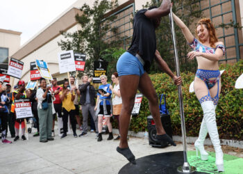 US-UNIONIZED-STRIPPERS-JOIN-WGA-PICKET-LINE-IN-SOUTHERN-CALIFORN