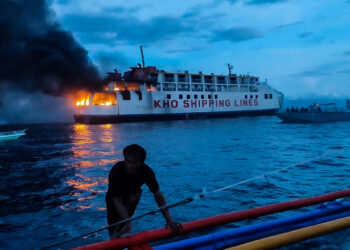 THE PHILIPPINES-BOHOL-BURNING FERRY